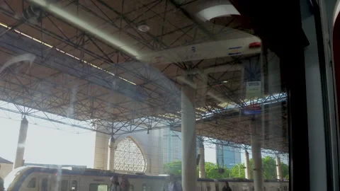 The train enters the train station, View From A Running Train In Malaysia, Stock Footage 134757026