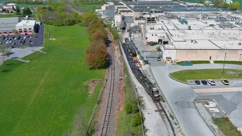 Train Exiting Freight Station Aerial 4K Vídeo Stock 239353064