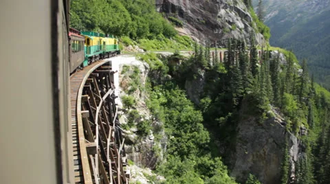 Train exits tunnel with beautiful view Stock Footage 25887893