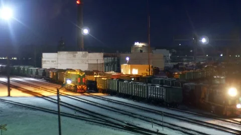 Train in factory at night Stock Footage 72875068