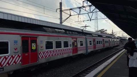 Train in fine weather passing through the station Stock-Footage 269502937