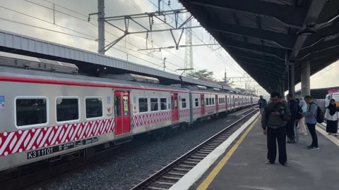 Train in fine weather passing through the station Stock-Footage 269502953