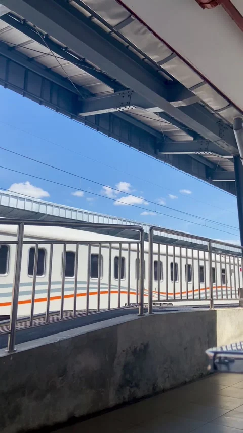 Train in fine weather passing through the station Stock-Footage 270009860