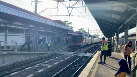 Train in fine weather passing through the station Stock-Footage 270009885