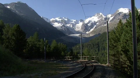 Train in Front Of Bernina Glacier  Stock Footage 502421