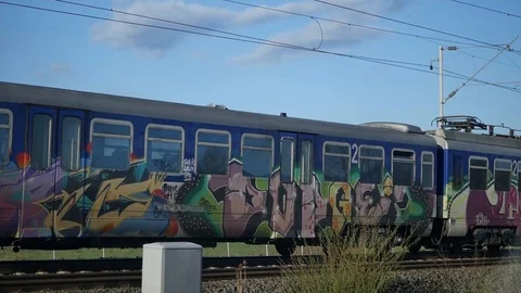 Train full of graffiti passing by Stock Footage 88411151