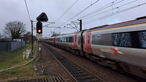 Train at full speed passing by train station. Stock Footage 234420018