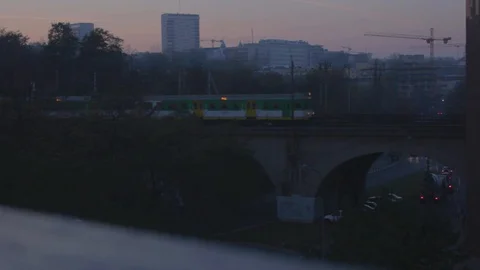 The train goes over the bridge. Sunset. Dusk. Warsaw, Poland. Stock Footage 100243226
