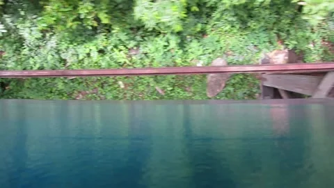 Train goes over a rickety bridge in Thailand Stock Footage 147865054