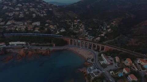 The train goes through the mountains Stockbeeldmateriaal 76353318