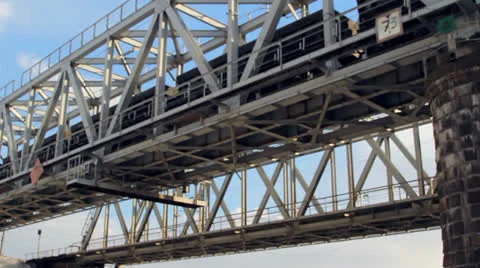Train goes through railway bridge Stock Footage 22519449