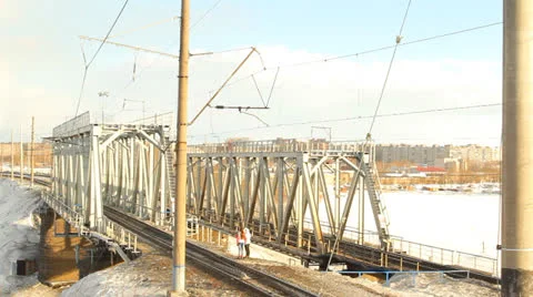 Train goes through railway bridge Stock Footage 22542707