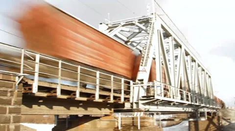 Train goes through railway bridge Stockbeeldmateriaal 36775226