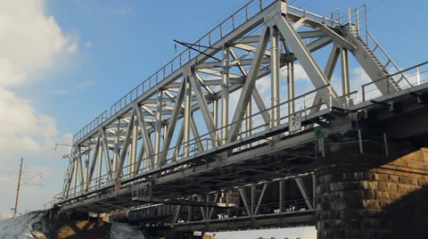 Train goes through railway bridge Stockbeeldmateriaal 36776143