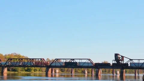 A train going across an old train track bridge Stock Footage 143441438