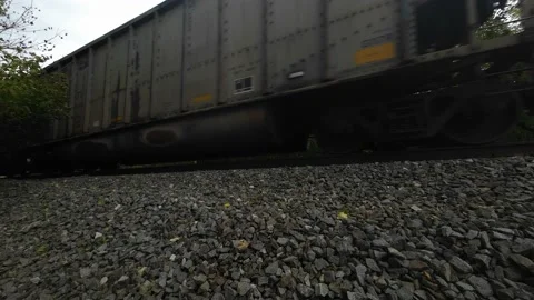 Train going across tracks on a cloudy day with sound and ending shot Stock Footage 219367109
