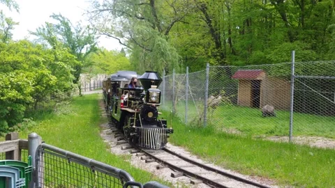 Train is going along the track with people wearing face masks Stock Footage 157440698