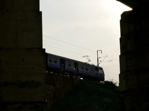 Train going between the bridge dark silhouette transportation background. 스톡 사진