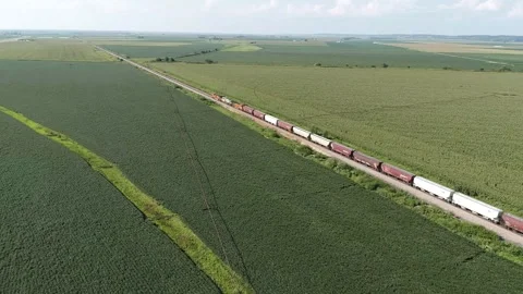 Train going through the middle of America Stock Footage 247375590