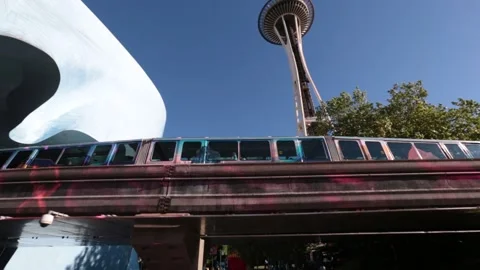 A train is going on top of a bridge with Seattle Space Needle in the background Stock Footage 155791128