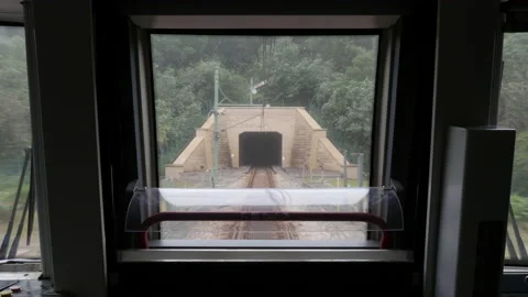 Train going into a tunnel Stock Footage 136090319