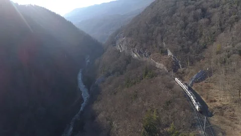 Train in Gorges de l'Areuse frontal traveling - Aerial 4K Stock Footage 87176979
