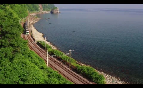 Train on the Hakodate Main Line Running Along Ishikari Bay Stock-Footage 333184318
