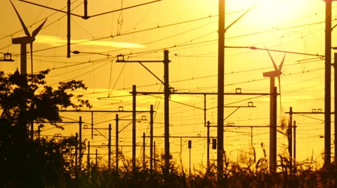Train is heading to the train station during a beautiful bright sunset Stock Footage 66495307