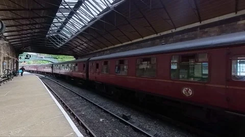 Train illuminated by the bright sunlight in Pickering railway station Stock-Footage 246431029
