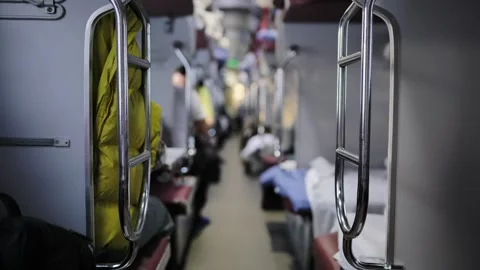 Train interior with aisle between berths, travelers on a long distance journey Vídeos de archivo 344697098