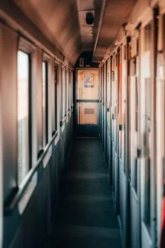 Train interior: Enter the bustling hall of the train, where passengers gath.. Stock Photos