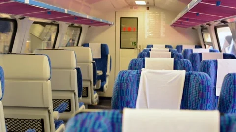 Train - interior - seats - first class - door in the background Stock Footage 41418248