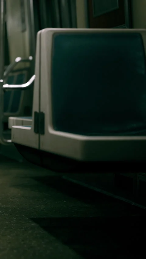 Train interior shows empty seats and platform Stock Footage 338412768