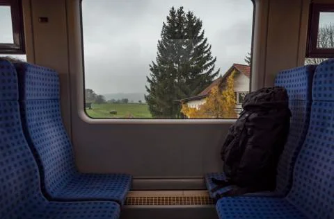 Train interior with a window view over bavarian nature Stock Photos
