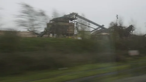 Train journey british fields and industrial land Stock Footage 112357478