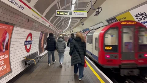 Train leaves Notting Hill Gate London Underground Station Stock Footage 332063302