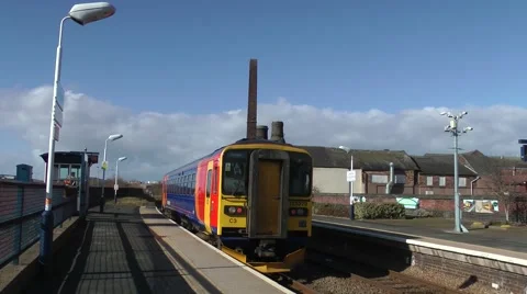 Train leaving arriving station old pottery factory bottle kiln background Stock Footage 47236434
