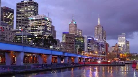 Train leaving CBD of a city at sunset Stock Footage 55123848