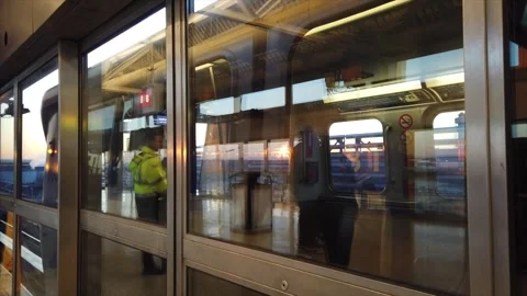 Train Leaving JFK as Sunrise Illuminates the Sky Stock Footage 249795960