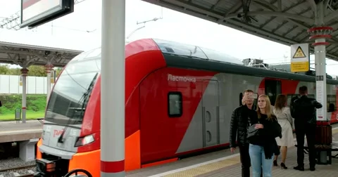 The train is leaving from platform, people differ Stock Footage 67469576