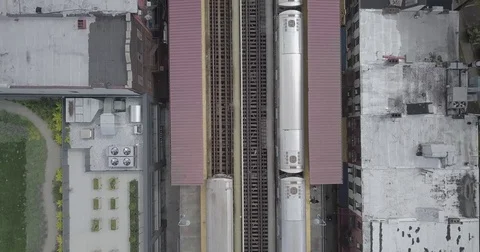 Train leaving station aerial Stock Footage 84129935