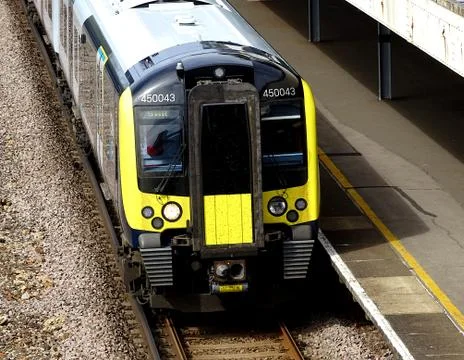 Train Leaving Station Platform Stock Photos