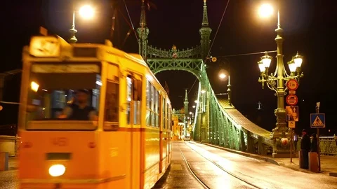 Train on the Liberty Bridge at night in Budapest Stock Footage 71578059