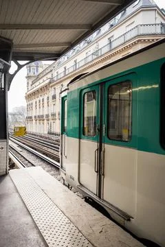 A train on line 6 of the Parisian elevated metro stops on a station platfor.. Stock Photos