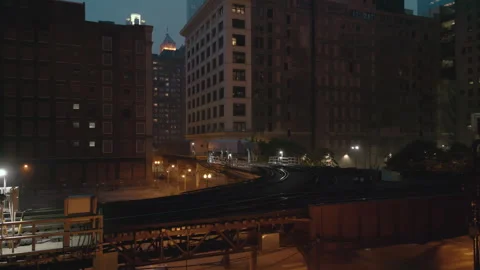 Train line on Elevated Track at Night time. Subway in downtown Chicago. Drone Stock-Footage 246762889