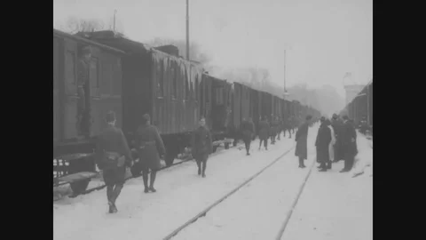 Train loaded with supply arrives and receive material from warehouse - 1918-1919 Stock Footage 86447491