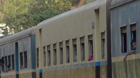 TRAIN - LOCOMOTIVE: Side view of passing train with passengers in windows Stock Footage 36486944