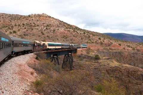 Train in motion with desertic landscape in the background. Stock-Fotos