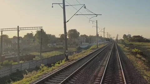 Train in motion. Railway. The train passes by the industrial area. Stock-Footage 165740737