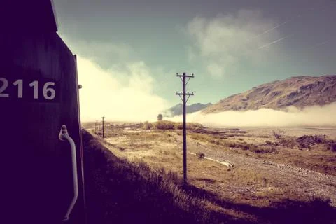 Train in Mountain fields landscape, New Zealand Stock Photos